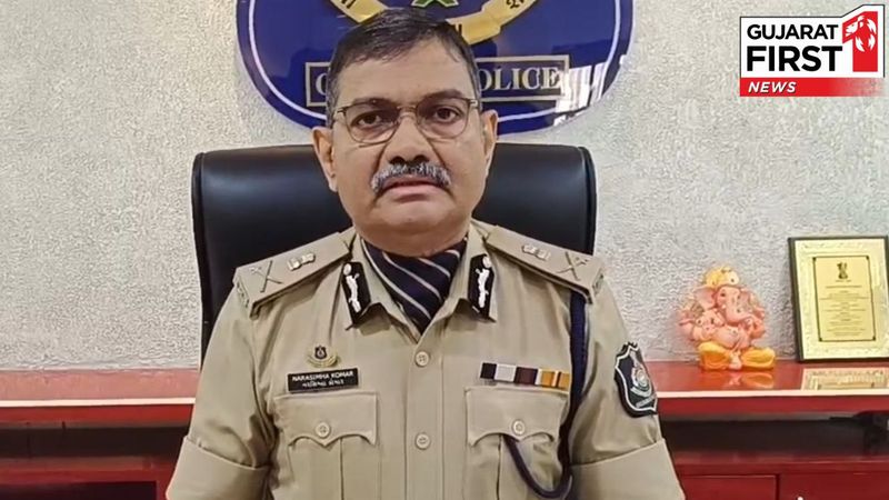 Narasimha Komar seated in his office in Gujarat Police uniform during a media address.